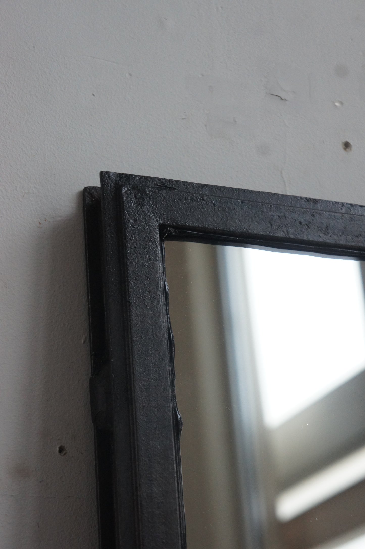 Iron frame mirror